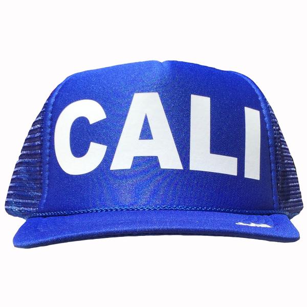 Cali in white ink on the front panel of a Royal blue mesh trucker cap with an adjustable snapback