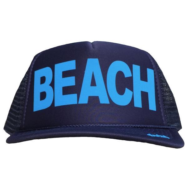 BEACH in light blue ink on the front panel of a classic mesh navy trucker cap with an adjustable snapback