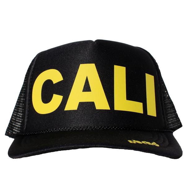Cali in yellow ink on the front panel of a black mesh trucker cap with an adjustable snapback