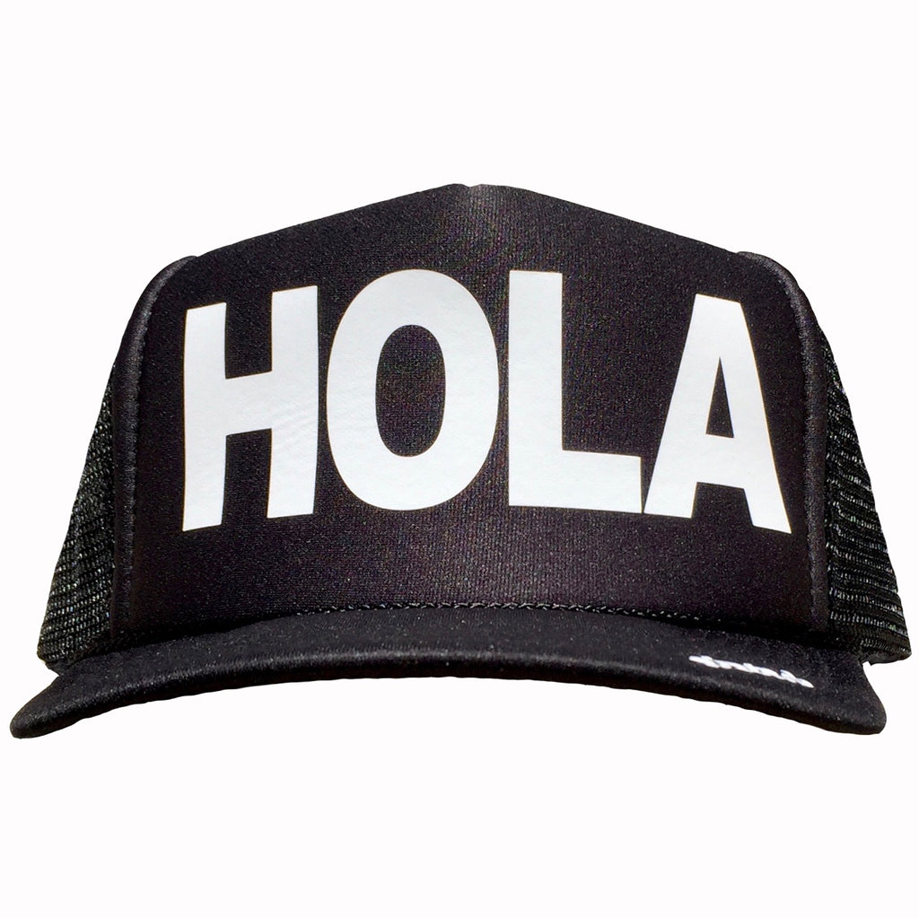 Hola in white ink on the front panel of a black mesh trucker cap with an adjustable snapback