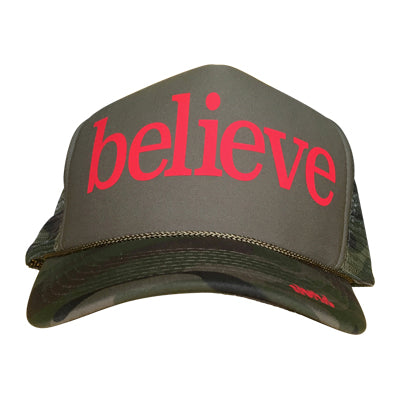 Believe in red ink on the front panel of a classic mesh olive trucker cap with an adjustable snapback