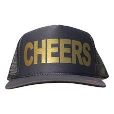 Cheers in gold ink on the front panel of a black mesh trucker cap with an adjustable snapback