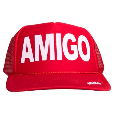 Amigo in white ink on the front panel of a classic mesh red trucker cap with an adjustable snapback