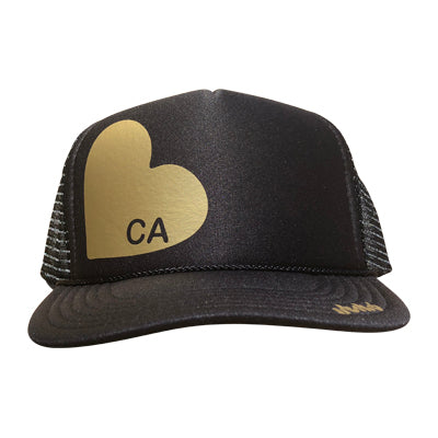 Heart with CA in gold ink on the front panel of a black mesh trucker cap with an adjustable snapback