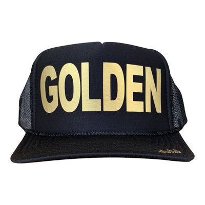 Golden in gold ink on the front panel of a black mesh trucker cap with an adjustable snapback