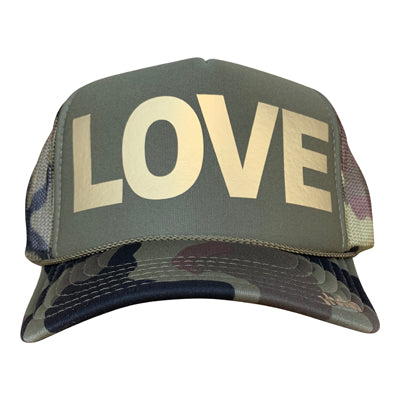 LOVE in gold ink on the front panel of a classic mesh olive-camo trucker cap with an adjustable snapback