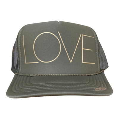 LOVE in gold ink on the front panel of a classic mesh charcoal trucker cap with an adjustable snapback