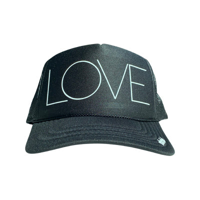 LOVE in white ink on the front panel of a classic mesh charcoal trucker cap with an adjustable snapback