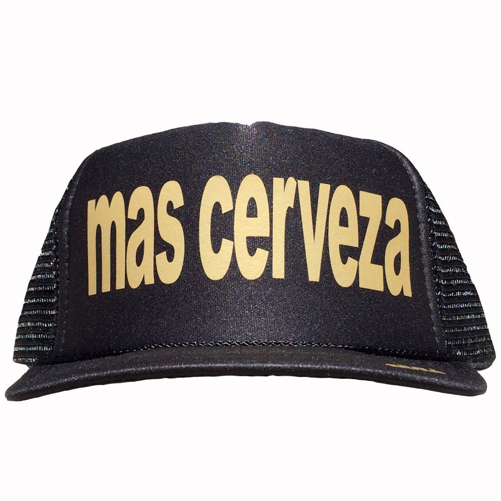 Mas Cerveza in gold ink on the front panel of a classic mesh black trucker cap with an adjustable snapback