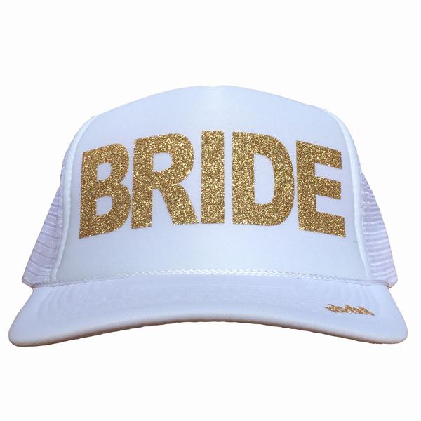 Bride in glitter gold ink on the front panel of a white trucker cap with an adjustable snapback