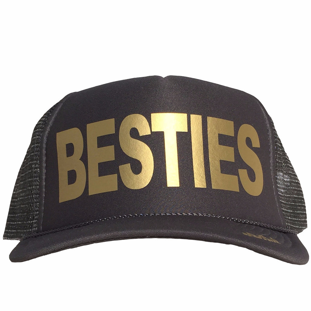 Besties in gold ink on the front panel of a classic mesh black trucker cap with an adjustable snapback