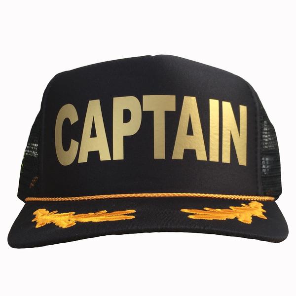 Captain in gold ink on the front panel of a black mesh trucker cap with an adjustable snapback