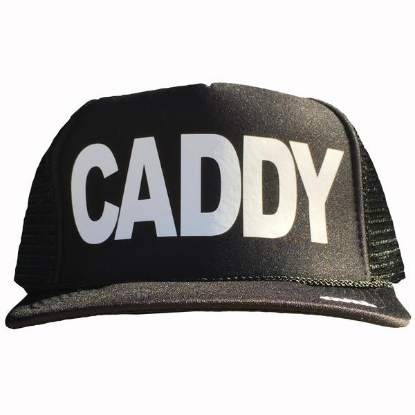 Caddy in white ink on the front panel of a black mesh trucker cap with an adjustable snapback
