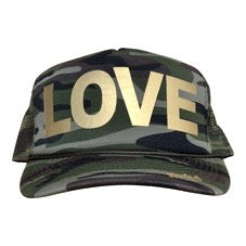 LOVE in gold ink on the front panel of a classic mesh camo trucker cap with an adjustable snapback