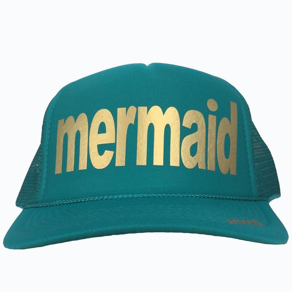 Mermaid in gold ink on the front panel of a  mesh jade trucker cap with an adjustable snapback